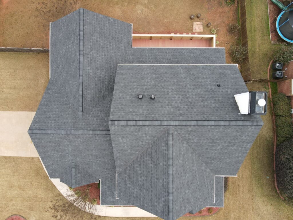 Aerial view of a new roof installation that has been completed according to the results of a detailed roof inspection by roofers in Atlanta.
